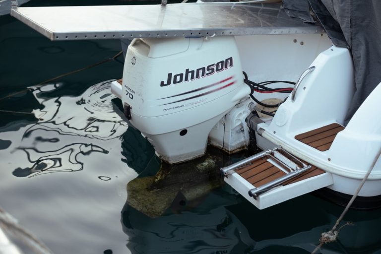 Close-up of a Johnson outboard motor mounted on a boat transom.
